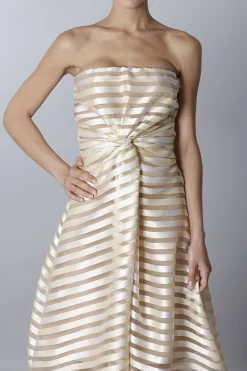 Abito bustier oro con trasparenze