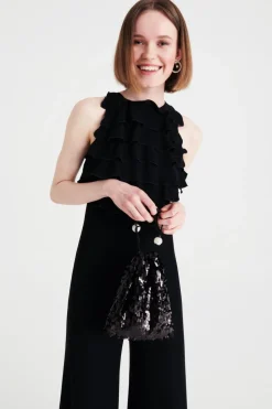 Jumpsuit nera in crepes con rouches