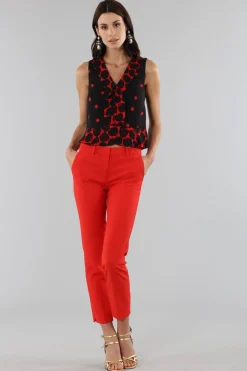 Top corto a pois con bordo asimmetrico