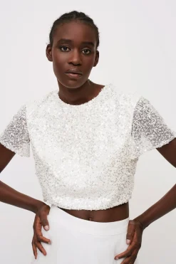 Top paillettes e gonna bianca