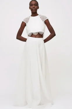 Top pizzo e gonna bianca