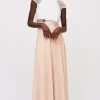 Top pizzo e gonna rosa